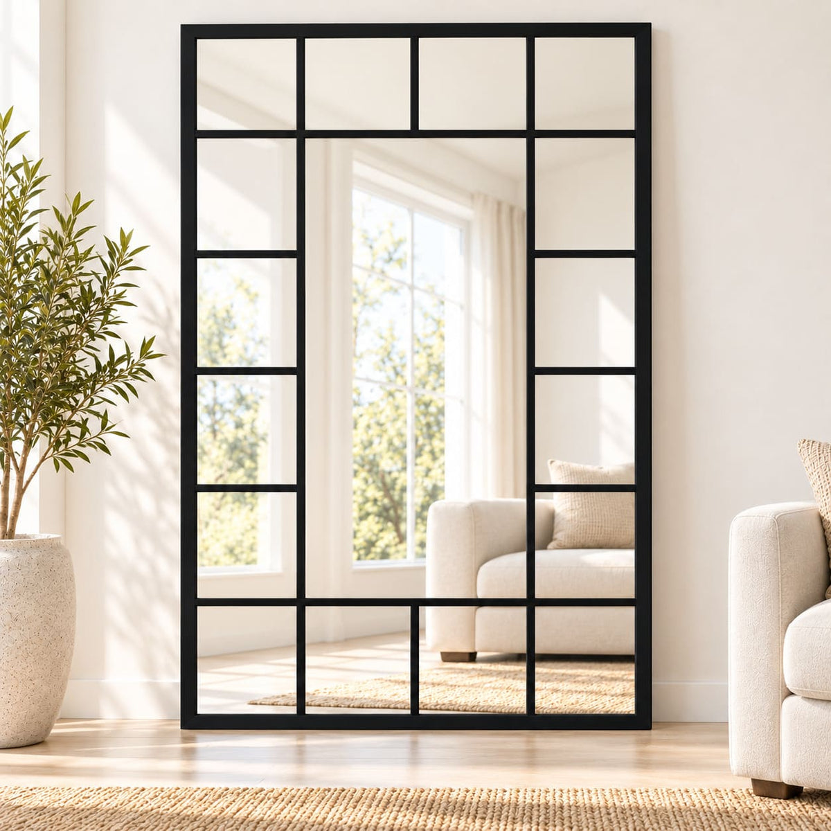 Espejo tipo ventana MAX negro de gran formato apoyado en living moderno y luminoso.