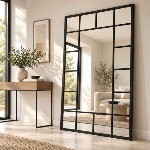 decorativo.jpgEspejo ventana negro grande con divisiones decorativas en ambiente moderno de tonos neutros.