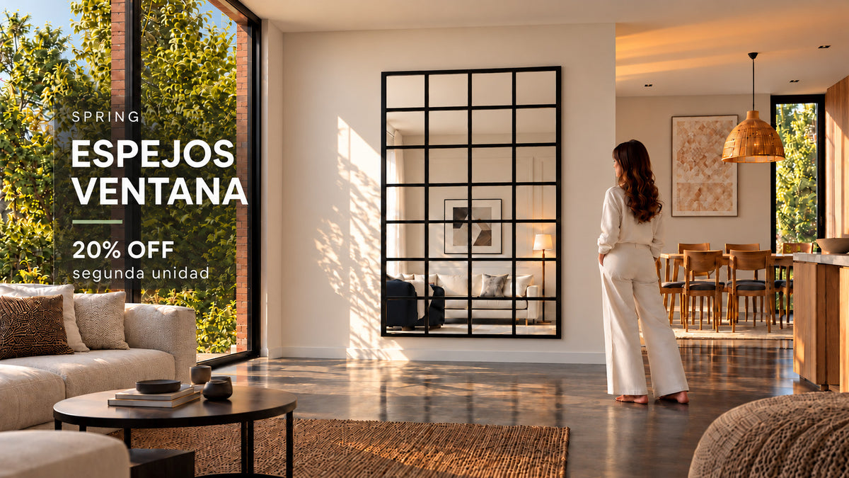 Espejo ventana decorativo grande con marco negro, instalado en un living moderno y luminoso. Espejos decorativos  Yourhomeplan